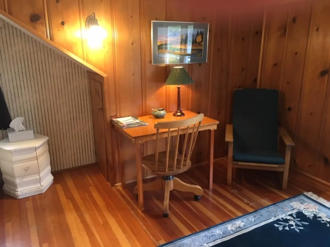 West Bedroom with full bed and pine paneling